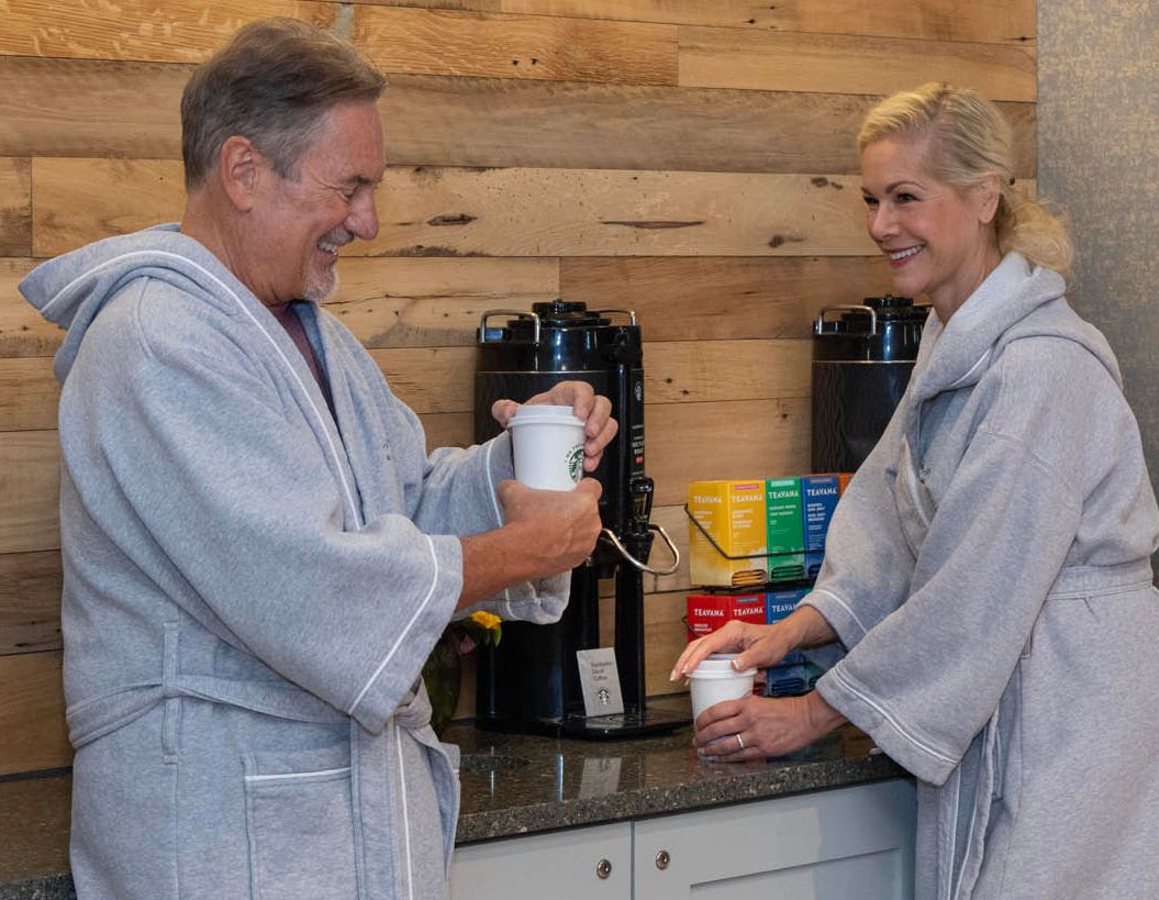 Couple enjoying the daily Starbucks® Coffee service on each floor at Chautauqua Harbor Hotel