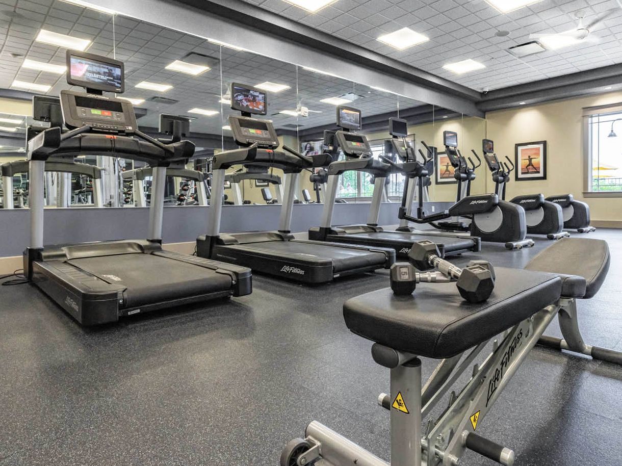 A fully-equipped fitness room including treadmills and weights at Chautauqua Harbor Hotel