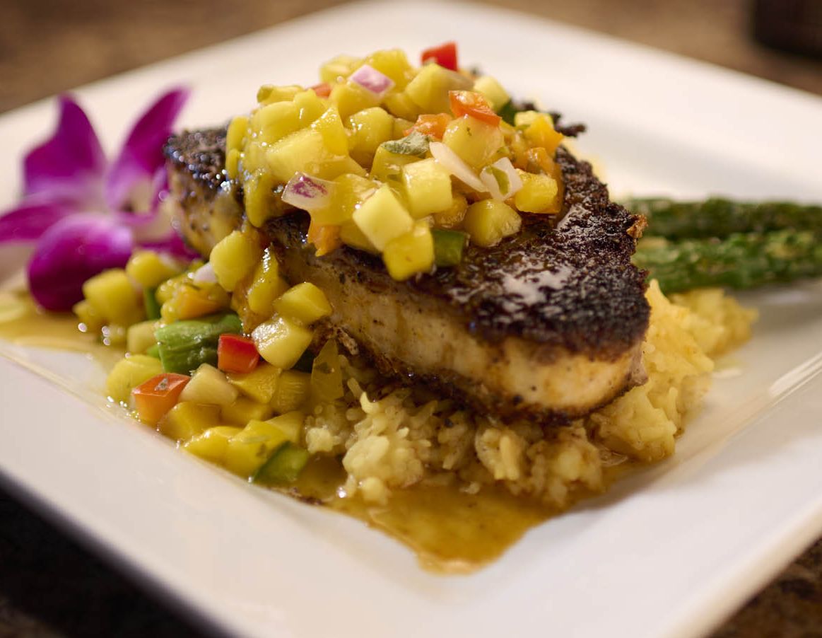 A plate of delicious salmon with mango at the Lakehouse Grille and Bar