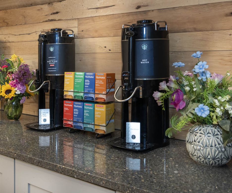 A row of carafes containing delicious blends of Starbucks coffee