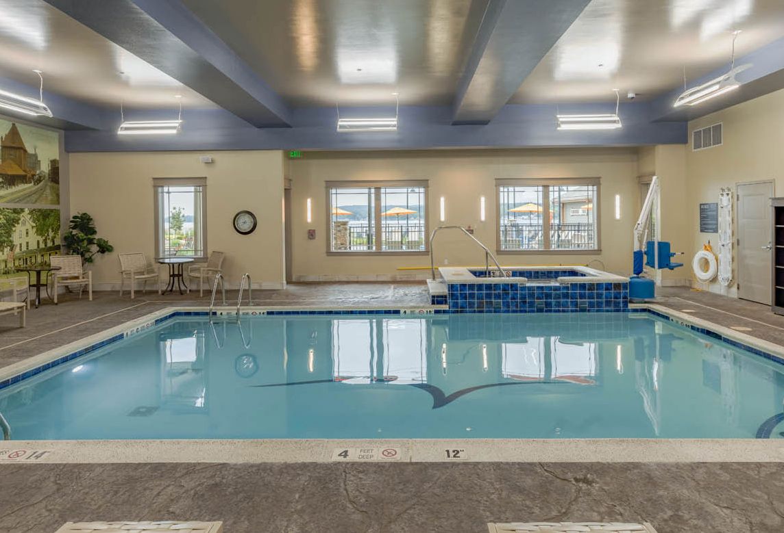 The indoor pool looking through the large glass windows at the Chautauqua Harbor Hotel